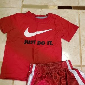 Red and white Nike outfit with black writing